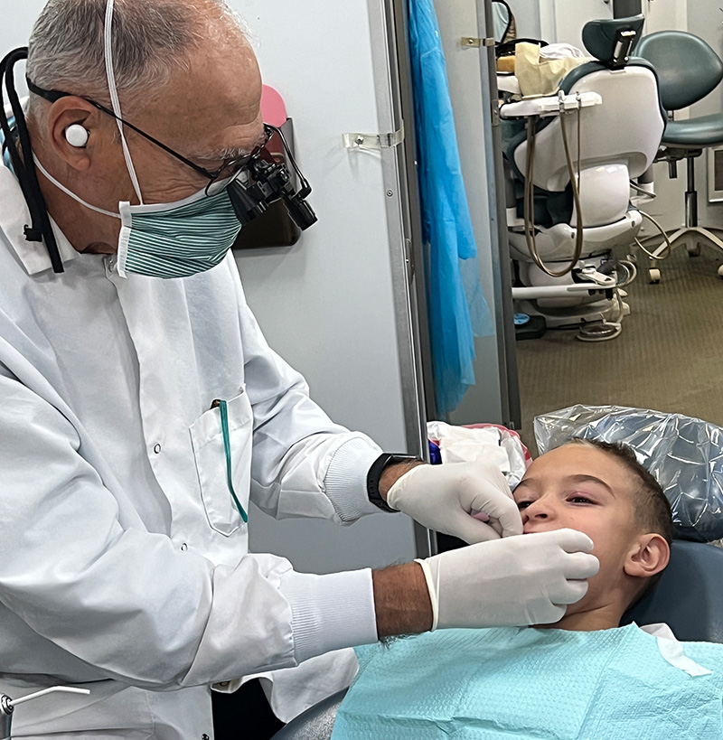 Dentist examining a patient's  teeth